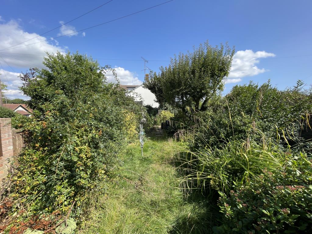 Lot: 103 - THREE-BEDROOM SEMI-DETACHED HOUSE FOR IMPROVEMENT - outside image of rear garden facing from rear of house